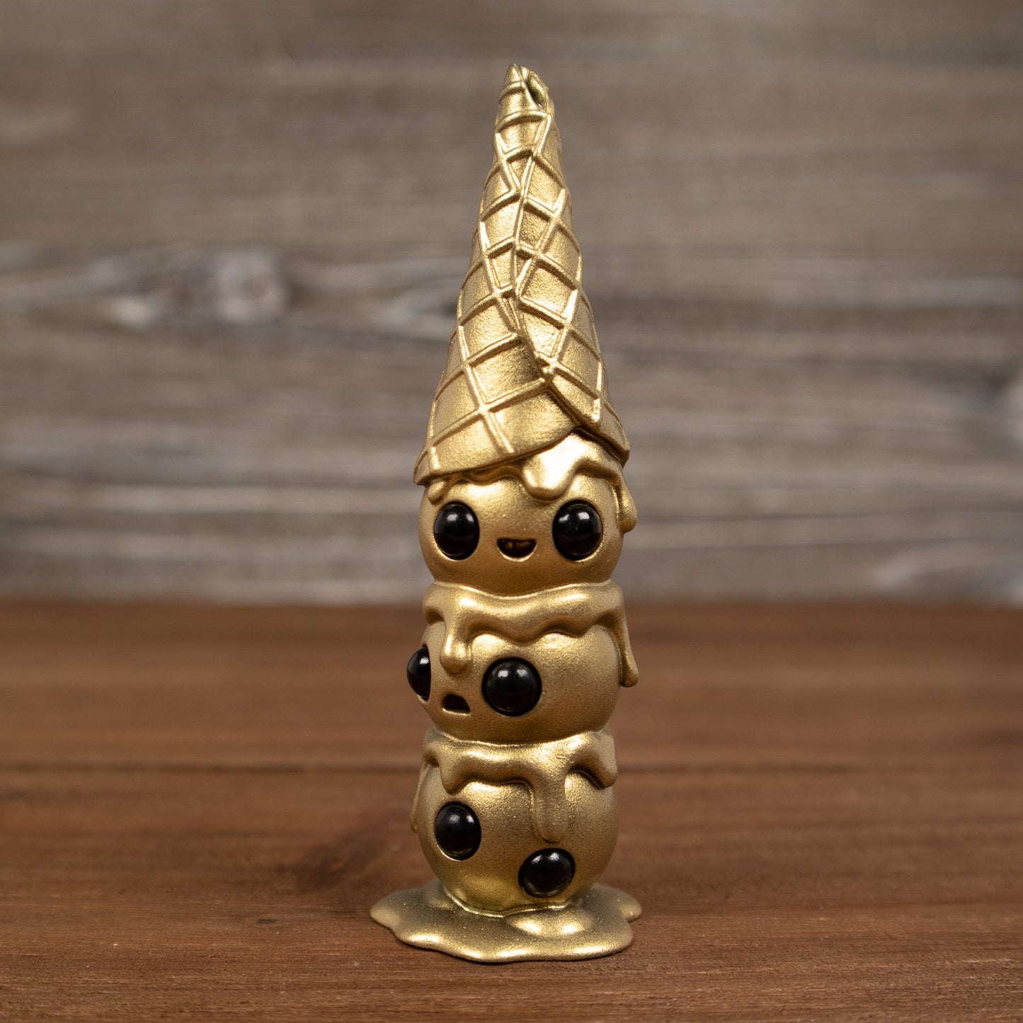 This is Wafull Melting Gold 3.75" Hand-Painted Resin Figure